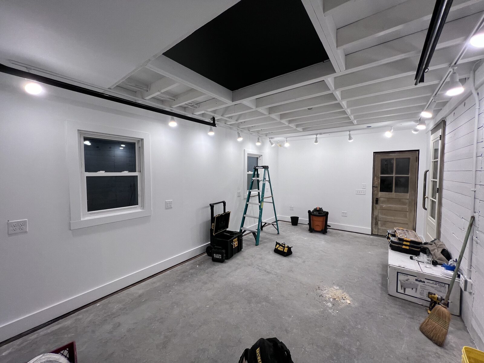 Finished room remodel with recessed lighting and track lighting